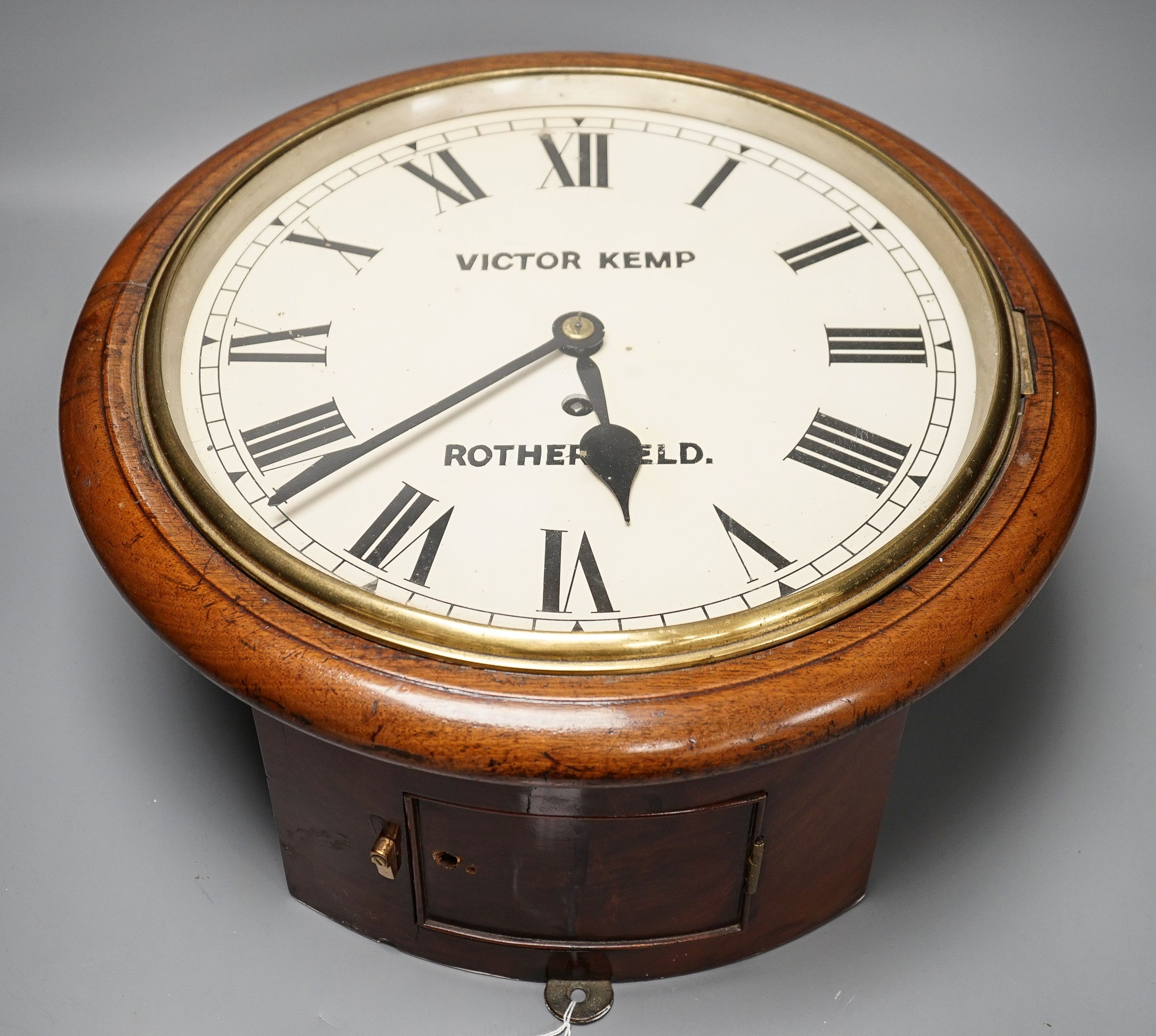 An early 20th century mahogany single fusee wall clock, the dial signed Victor Kemp, Rotherfield, height 39cm